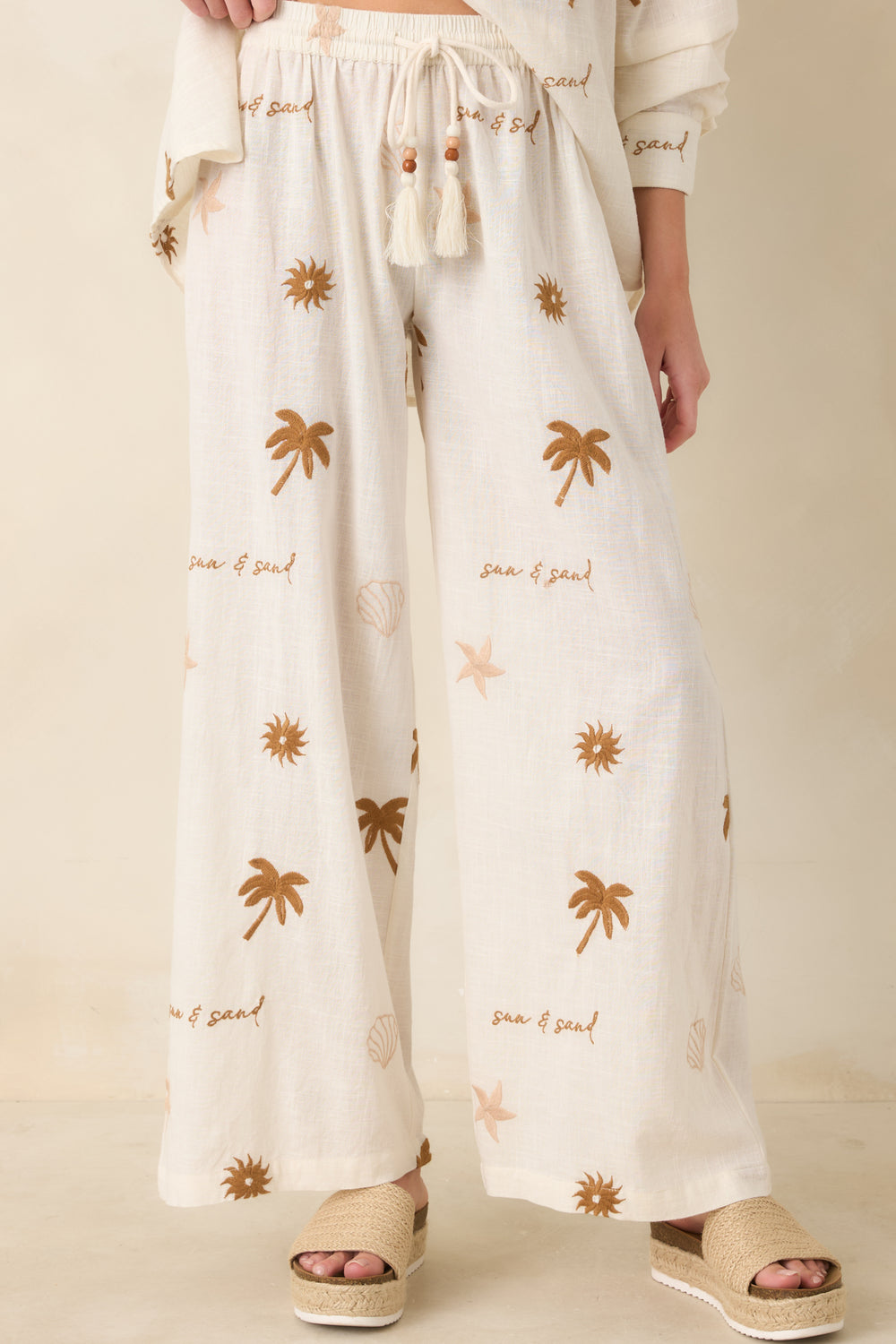 Beige-Pants-Featuring-Elastic-Waistband-And-Drawstring-Tie