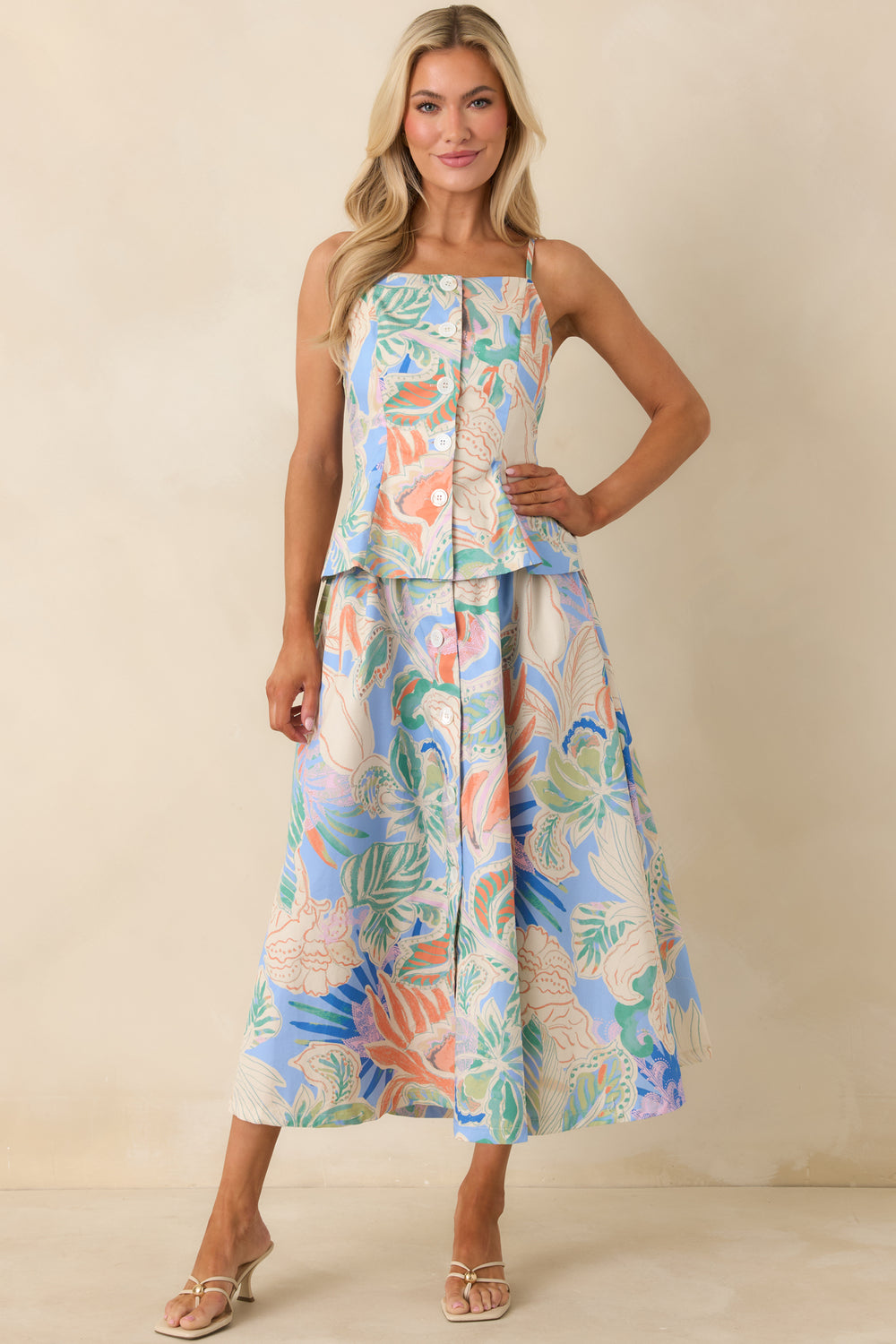 Blue-Patterned-Top-With-Fitted-Bodice-And-Peplum-Style-Hem