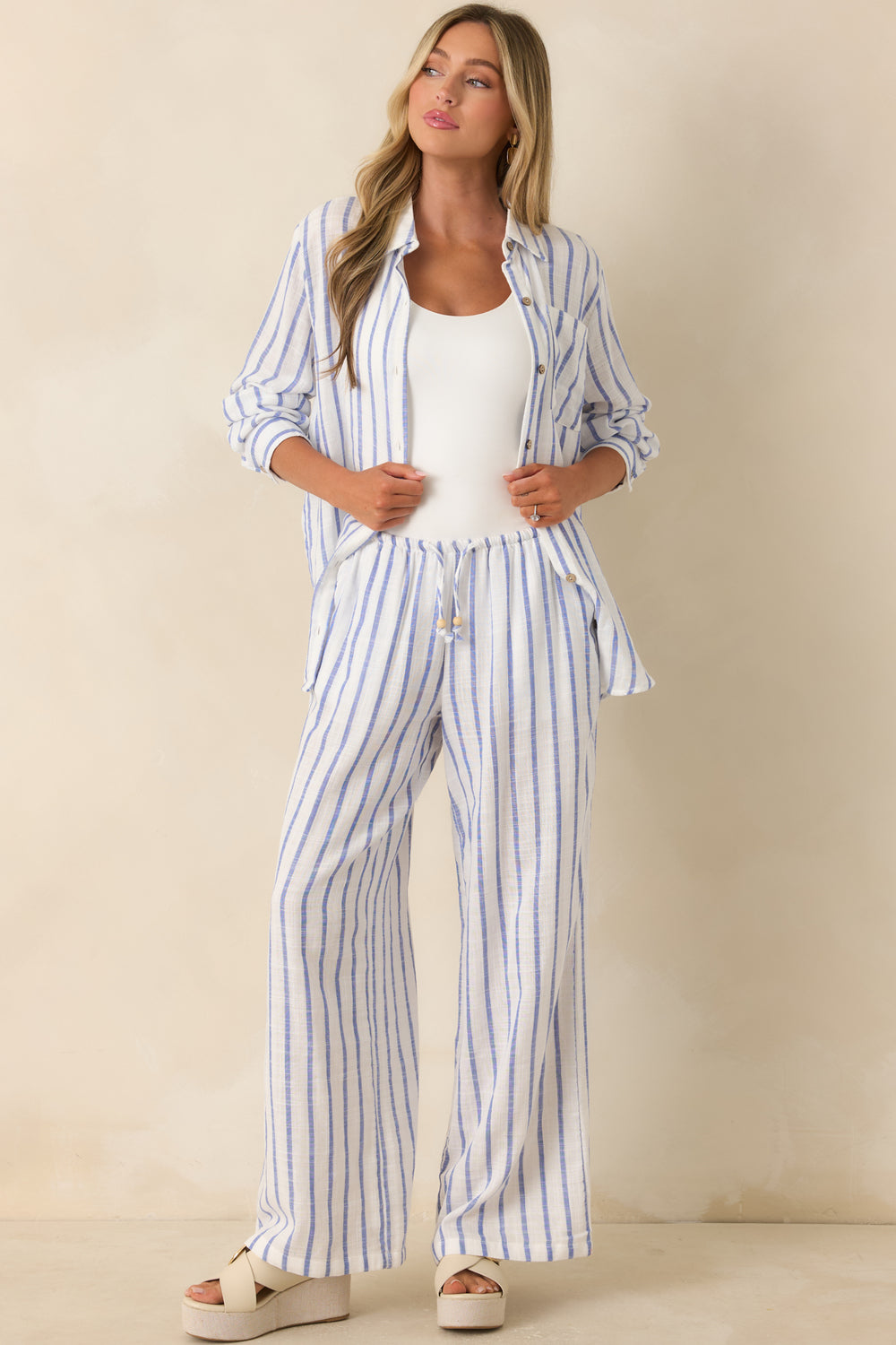 Blue-Striped-Button-Up-Shirt-Featuring-A-Collared-Neckline