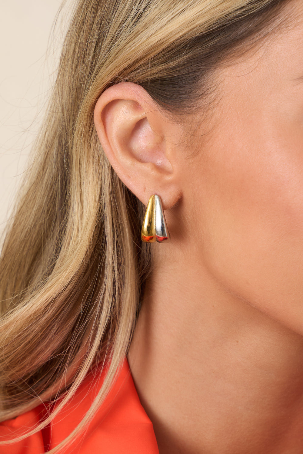 Earrings-Showing-Smooth-Metallic-Surfaces-And-Sculptural-Curves